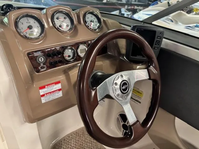 Slide: The Image of Dashboard of 2013 Chaparral 19 H2O Ski & Fish boat with gauges and steering wheel. - 8