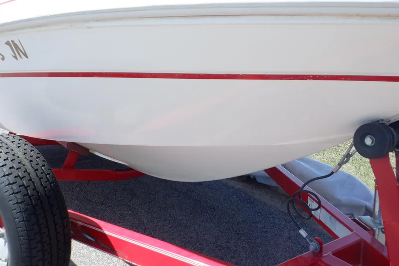 Slide: The Image of 2003 Glastron SX 195 boat on red trailer, side view. - 20
