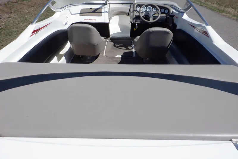 Slide: The Image of 2003 Glastron SX 195 boat interior with steering wheel and seating. - 3