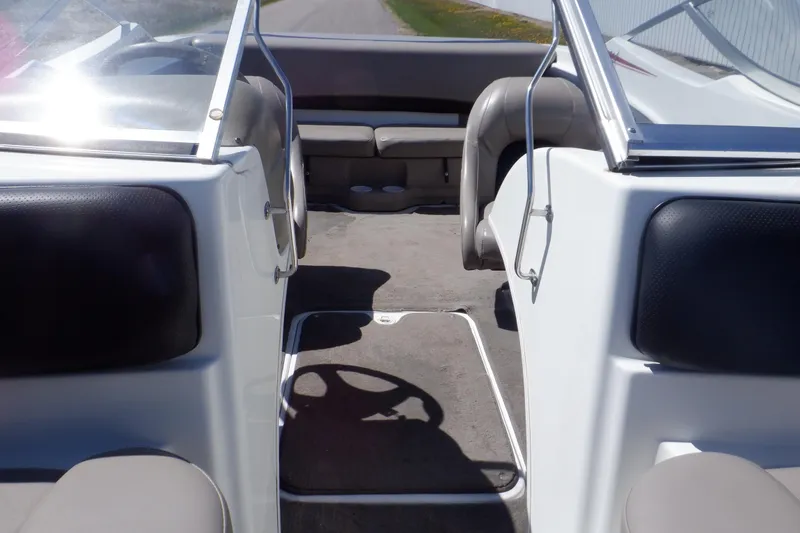 Slide: The Image of 2003 Glastron SX 195 boat interior with seating and steering wheel. - 35