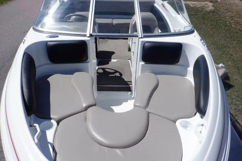 Slide: The Image of 2003 Glastron SX 195 boat interior with gray seating and windshield. - 4