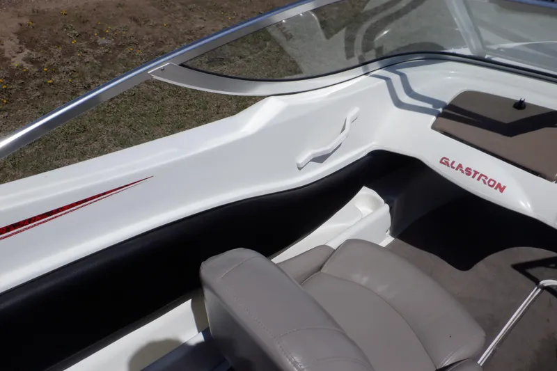 Slide: The Image of 2003 Glastron SX 195 boat interior with seating and windshield detail. - 43