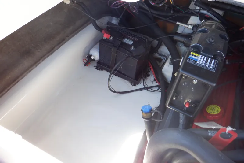 Slide: The Image of 2003 Glastron SX 195 boat engine compartment with battery and wiring. - 46