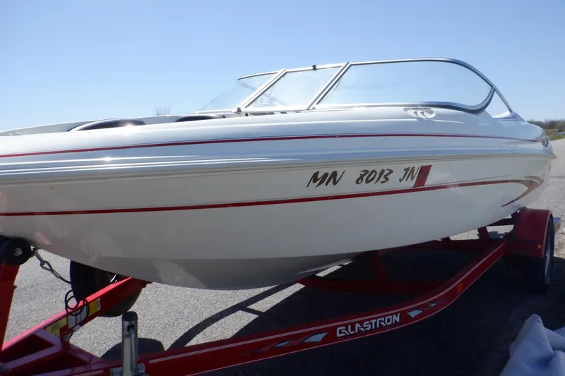 Slide: The Image of 2003 Glastron SX 195 boat on red trailer, side view. - 5