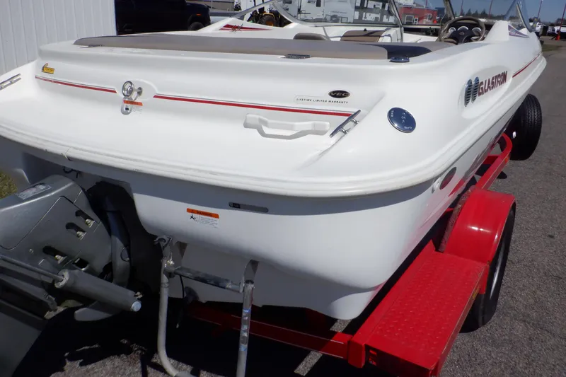 Slide: The Image of 2003 Glastron SX 195 boat on red trailer, rear view. - 6