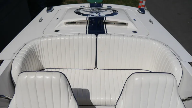 Slide: The Image of 2022 Donzi 22 Classic boat interior with white seating and sleek design. - 17
