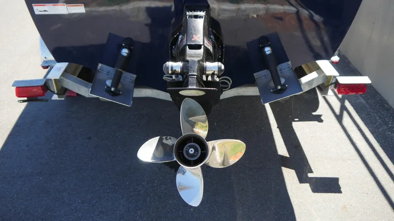 Slide: The Image of 2022 Donzi 22 Classic boat propeller and trim tabs on trailer. - 8