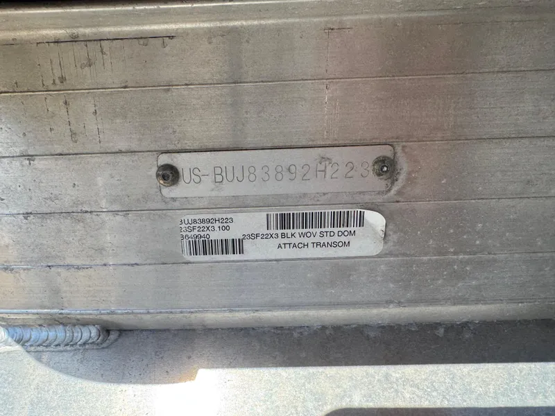 Slide: The Image of 2023 Sun Tracker SportFish 22 XP3 boat identification plate with serial number. - 3