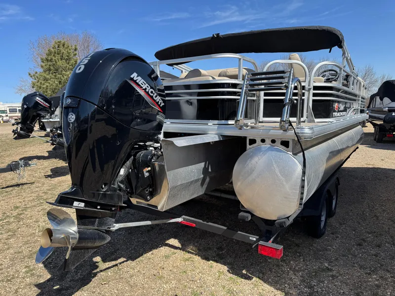 Slide: The Image of 2023 Sun Tracker SportFish 22 XP3 pontoon boat with Mercury outboard motor. - 4