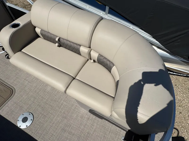 Slide: The Image of 2023 Sun Tracker SportFish 22 XP3 boat seat with beige upholstery and cup holder. - 6