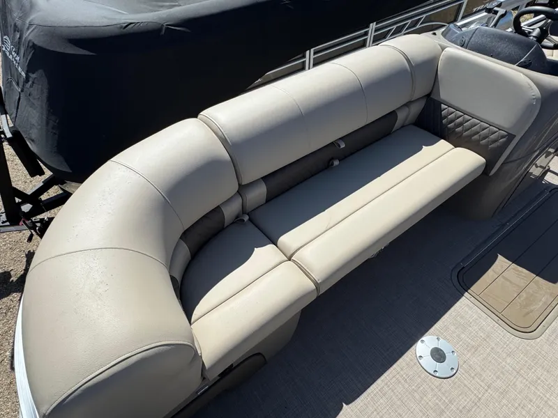 Slide: The Image of 2023 Sun Tracker SportFish 22 XP3 boat with beige seating and modern design. - 7