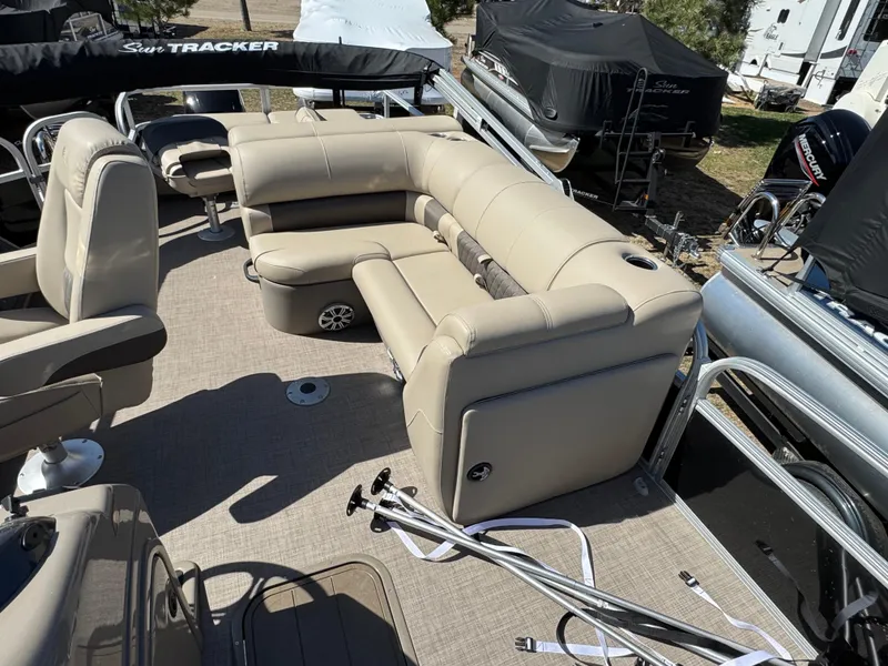 Slide: The Image of 2023 Sun Tracker SportFish 22 XP3 pontoon boat with beige seating and spacious deck layout. - 8
