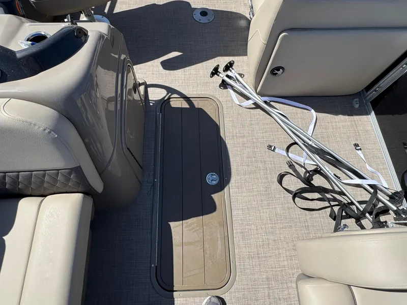 Slide: The Image of 2023 Sun Tracker SportFish 22 XP3 interior with seating and storage compartments. - 9