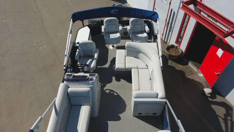 Slide: The Image of 2022 Crest Classic Fish 200 SF pontoon boat with spacious seating and canopy. - 5