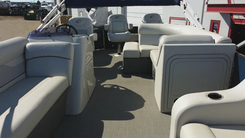 Slide: The Image of 2022 Crest Classic Fish 200 SF pontoon boat interior with spacious seating and helm. - 6