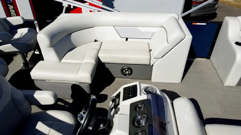 Slide: The Image of 2022 Crest Classic Fish 200 SF boat interior with plush seating and modern dashboard. - 7