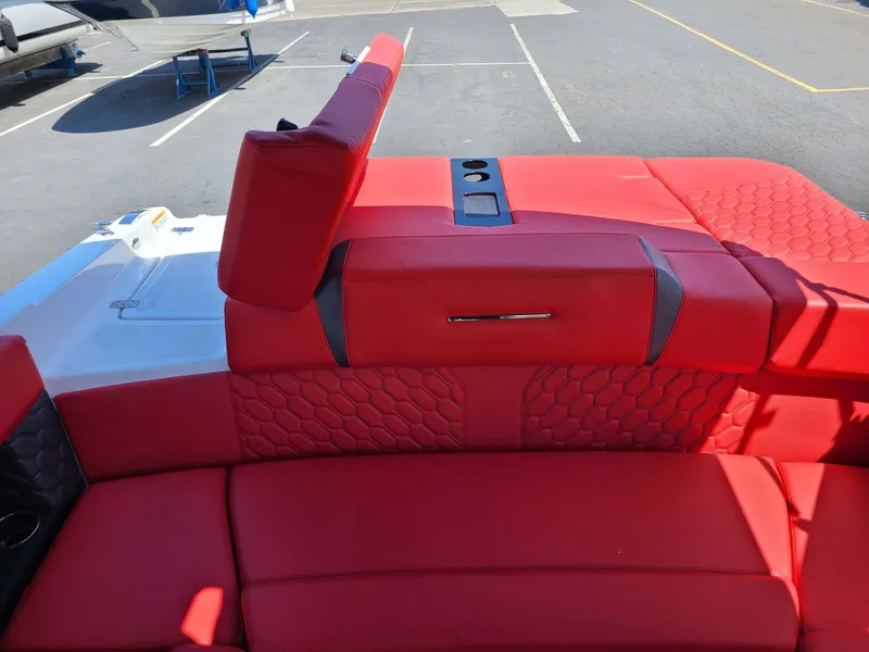 Slide: The Image of 2023 Four Winns H2 Surf boat with vibrant red seating and modern design. - 12