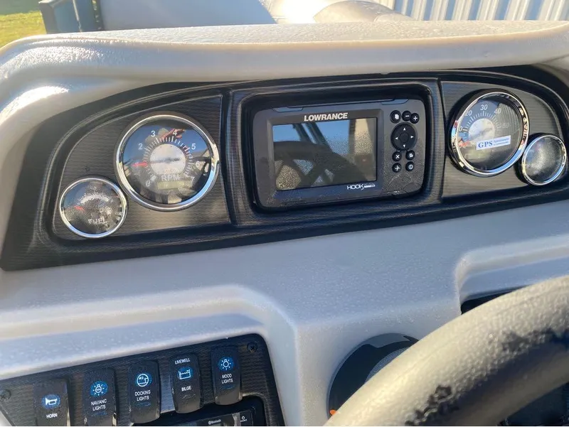 Slide: The Image of Dashboard of 2025 Trifecta LE Series 22RF LE with gauges and Lowrance GPS. - 10