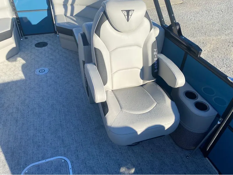 Slide: The Image of 2025 Trifecta LE Series 22RF LE boat interior with plush seating and cup holders. - 3