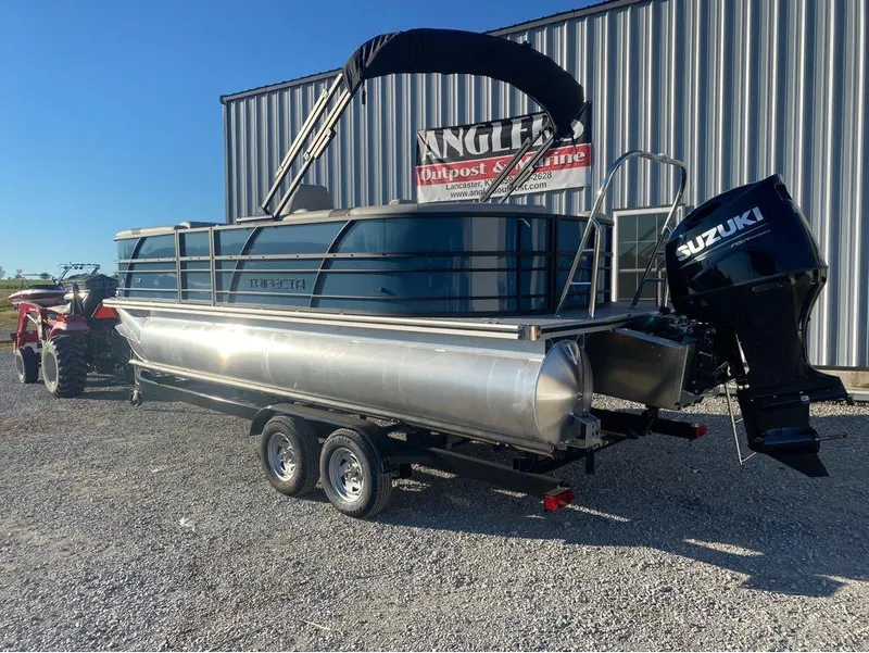 Slide: The Image of 2025 Trifecta LE Series 22RF pontoon boat with Suzuki motor on trailer. - 9