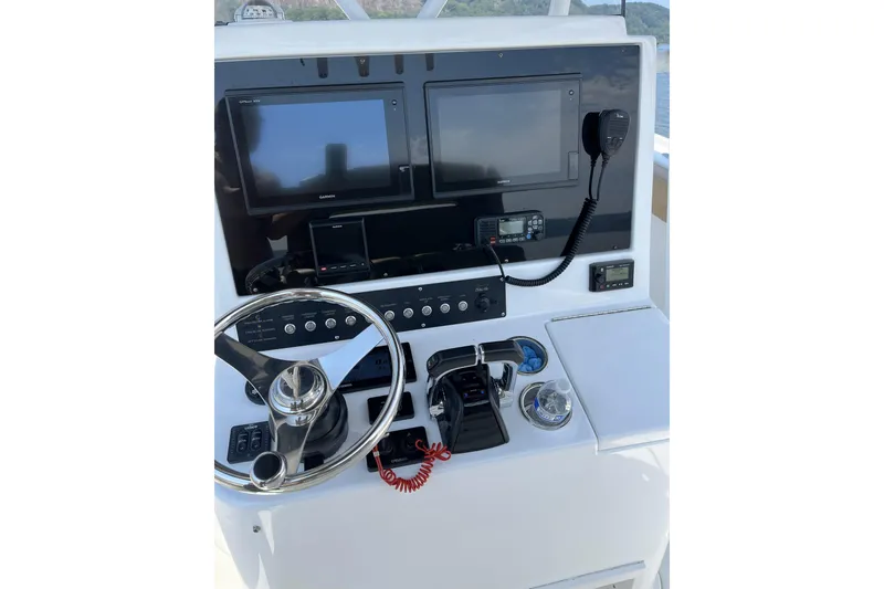 Slide: The Image of 2018 Buddy Davis 28 Center Console helm with dual screens and controls. - 7