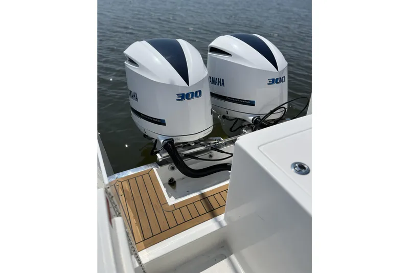 Slide: The Image of Twin Yamaha 300 engines on 2018 Buddy Davis 28 Center Console boat. - 9