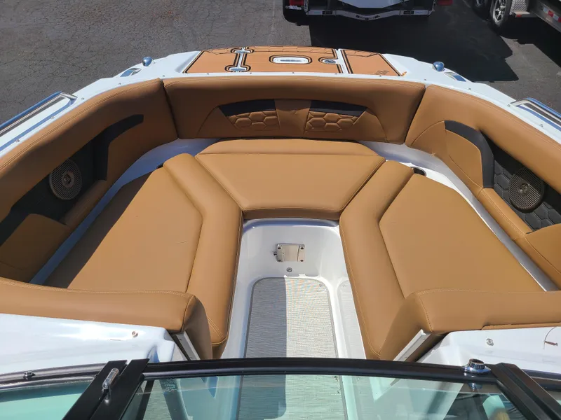Slide: The Image of 2023 Four Winns HD3 boat with tan seating and spacious bow area. - 13
