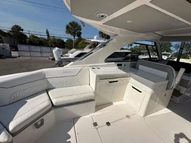 Slide: The Image of 2023 Regal LX36 boat interior with white seating and modern design. - 13