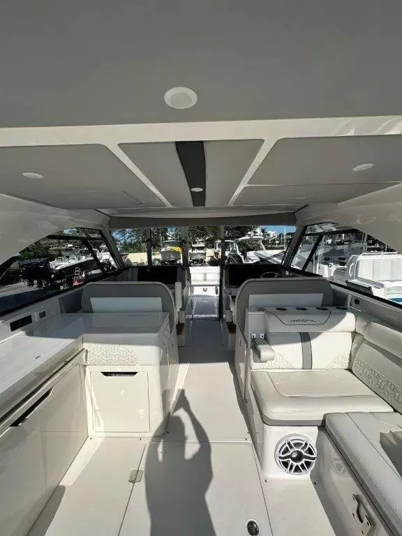 Slide: The Image of Interior of 2023 Regal LX36 boat, featuring modern seating and sleek design elements. - 16