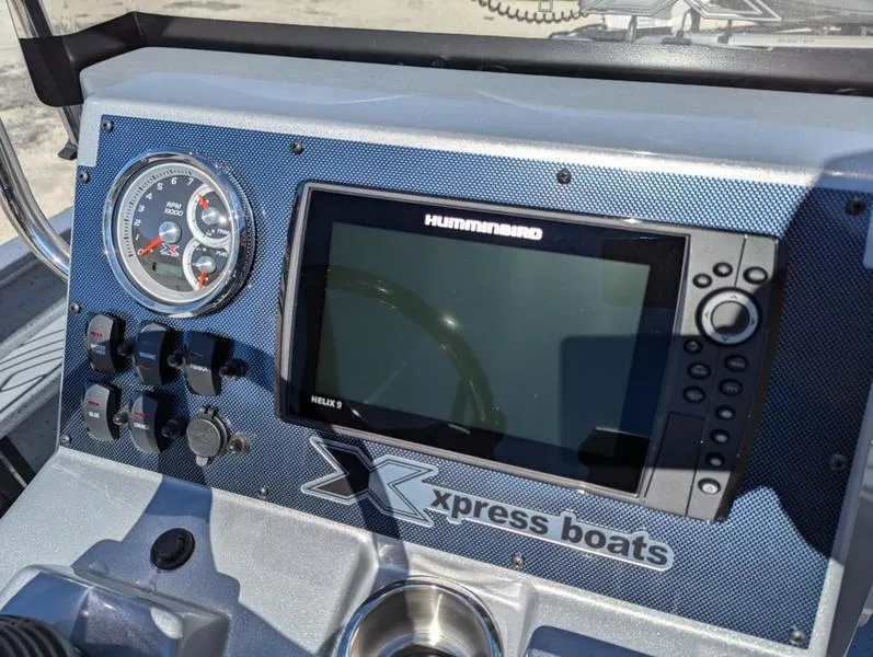 Slide: The Image of Dashboard of 2025 Xpress X23B Lounge boat with Humminbird Helix 5 display. - 11