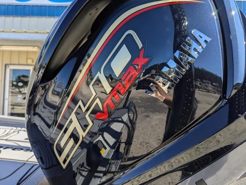 Slide: The Image of Yamaha SHO VMAX engine on 2025 Xpress X23B Lounge boat, reflecting outdoor scene. - 16