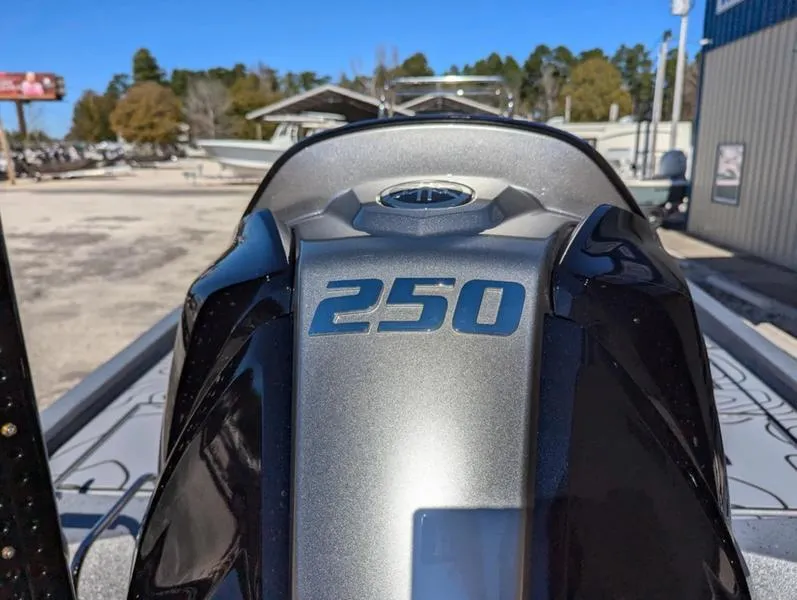 Slide: The Image of Close-up of 2025 Xpress X23B Lounge boat engine with '250' marking. - 18