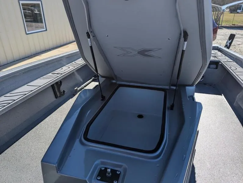 Slide: The Image of 2025 Xpress X23B Lounge boat storage compartment open, showcasing interior space. - 8