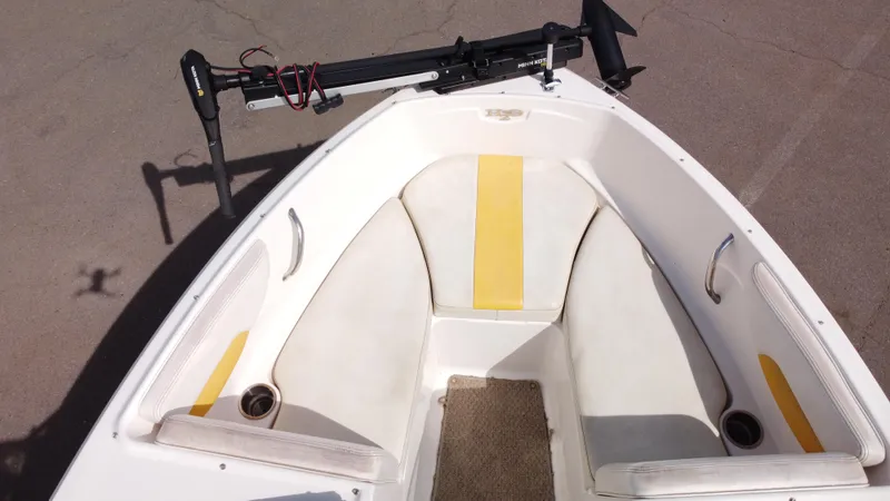 Slide: The Image of 2012 Chaparral 19 Ski & Fish H2O boat interior with seating and trolling motor. - 14