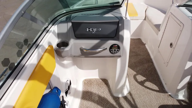 Slide: The Image of 2012 Chaparral 19 Ski & Fish H2O boat interior with seating and control panel. - 16