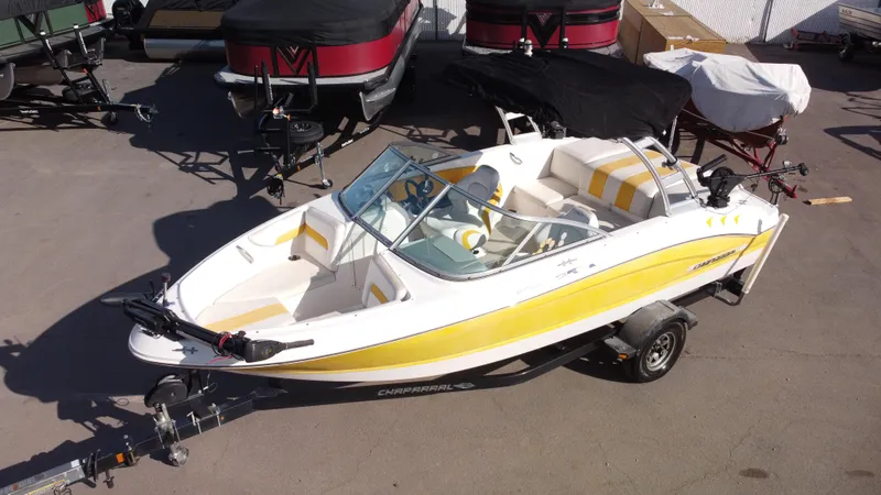 Slide: The Image of 2012 Chaparral 19 Ski & Fish H2O boat with yellow accents on a trailer. - 18