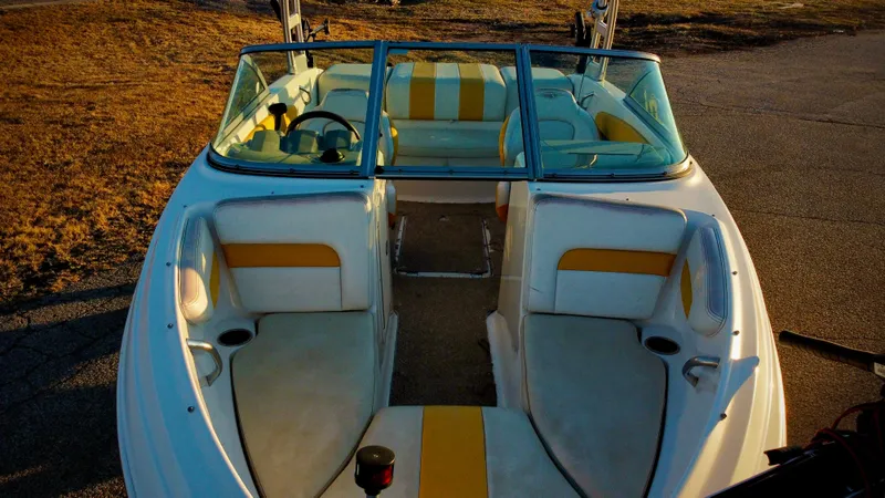Slide: The Image of 2012 Chaparral 19 Ski & Fish H2O boat with yellow and white interior. - 2