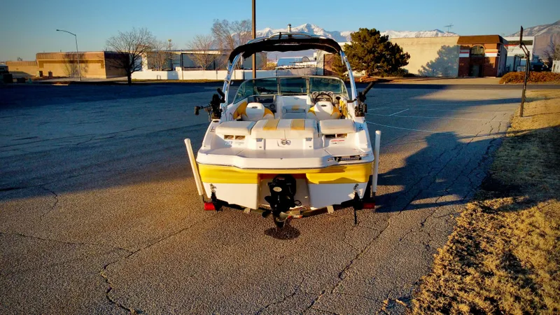 Slide: The Image of 2012 Chaparral 19 Ski & Fish H2O boat parked on asphalt in sunny setting. - 4