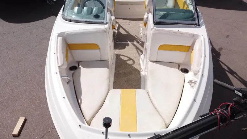 Slide: The Image of 2012 Chaparral 19 Ski & Fish H2O boat interior with white and yellow seating. - 7