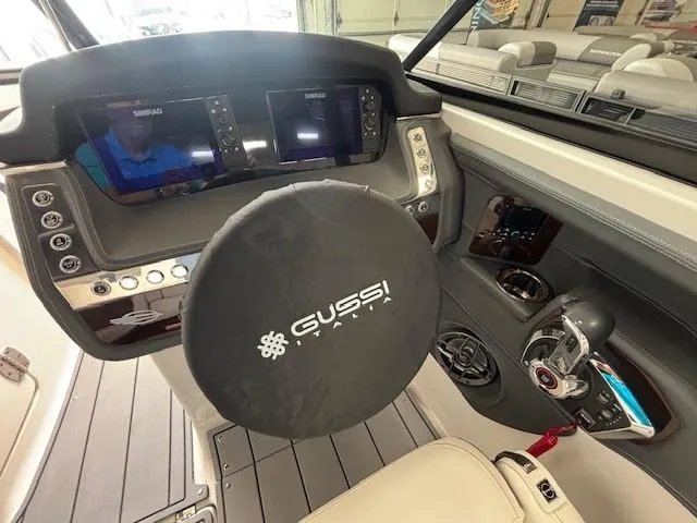Slide: The Image of 2023 Chaparral 267 SSX boat dashboard with Gussi Italia steering wheel cover. - 16