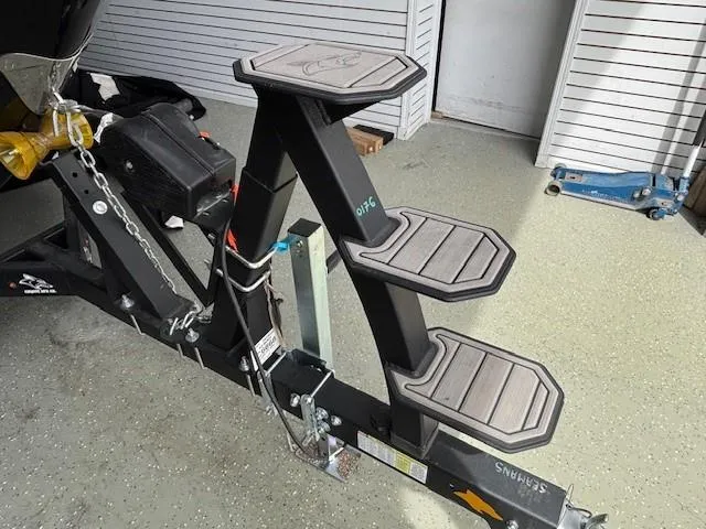 Slide: The Image of Trailer steps for 2023 Chaparral 267 SSX boat, featuring sturdy design and non-slip treads. - 24