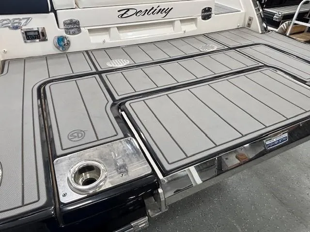 Slide: The Image of 2023 Chaparral 267 SSX boat deck with "Destiny" nameplate and sleek design. - 4