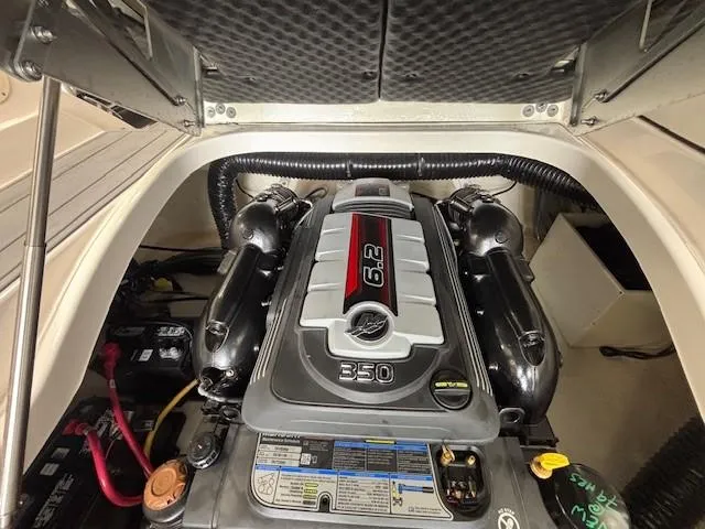 Slide: The Image of 2023 Chaparral 267 SSX boat engine compartment with 6.2L 350 horsepower engine. - 8