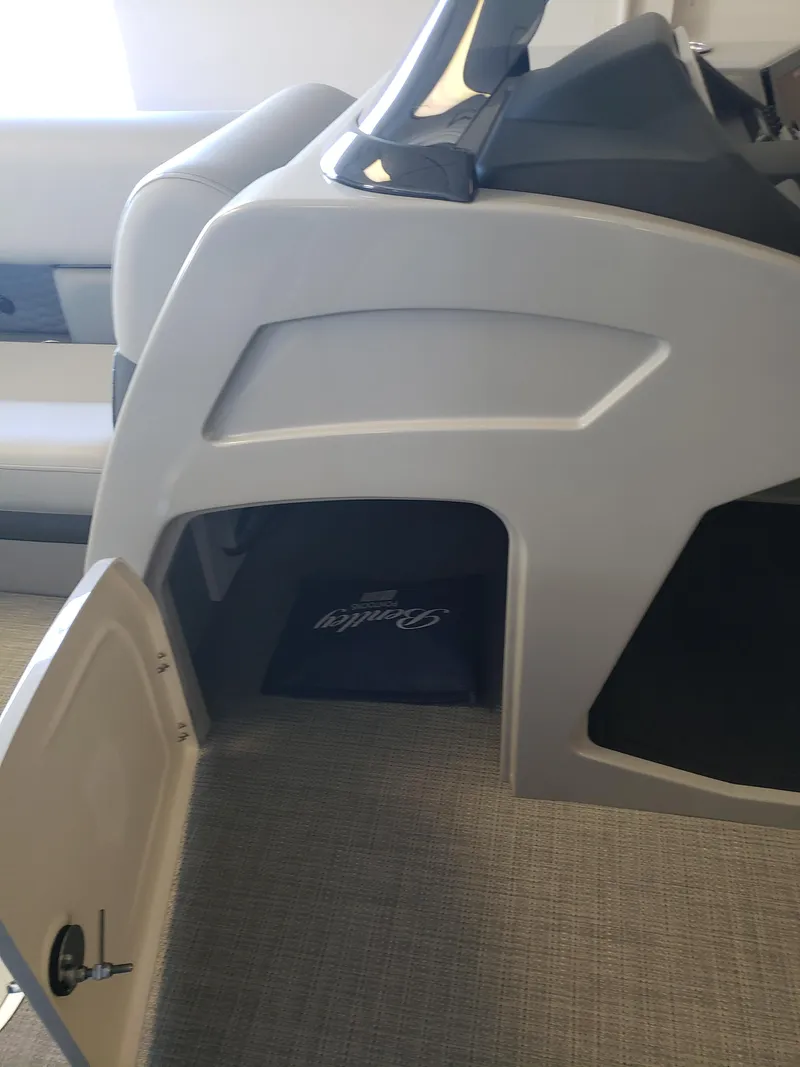Slide: The Image of 2025 Bentley Pontoons Elite Admiral interior storage compartment with open door. - 13