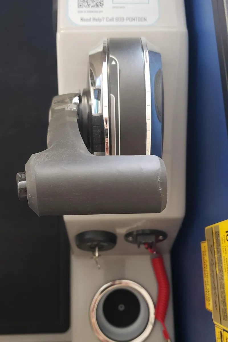 Slide: The Image of 2025 Bentley Pontoons Elite Admiral throttle control and ignition panel. - 16