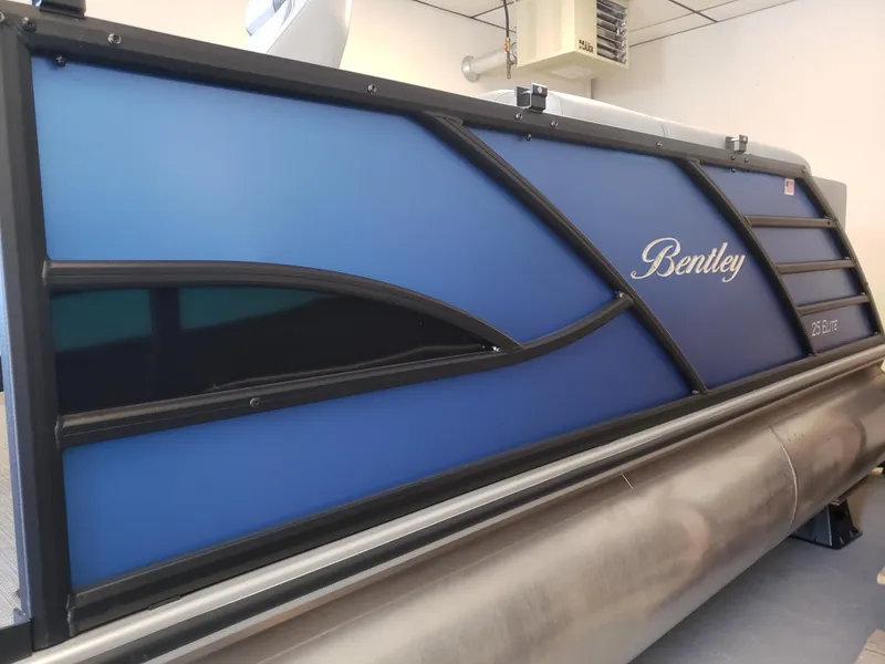 Slide: The Image of 2025 Bentley Pontoons Elite Admiral, blue paneling, sleek design, luxury pontoon boat. - 4