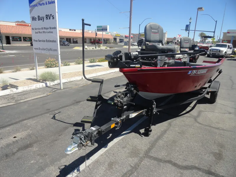 Slide: The Image of 2024 Tracker Pro Guide V-16 SC boat on trailer in parking lot. - 18