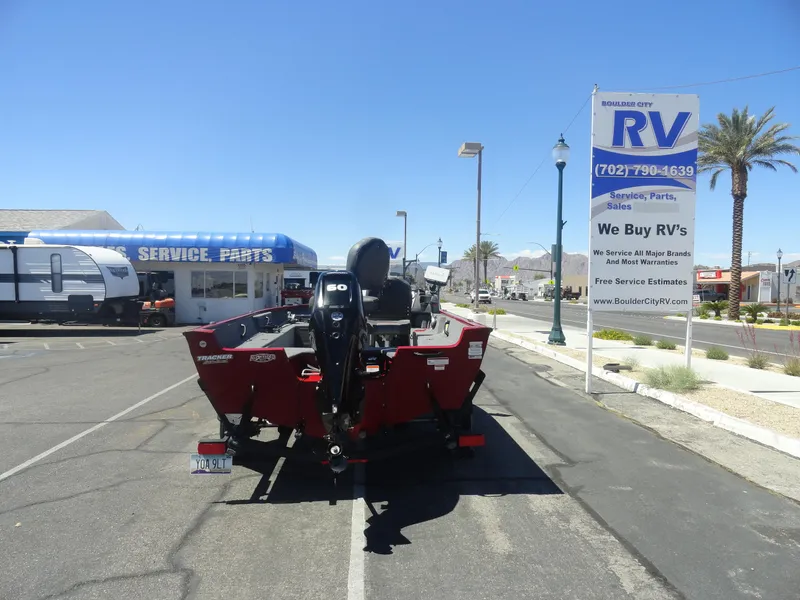 Slide: The Image of 2024 Tracker Pro Guide V-16 SC boat parked near RV service center. - 19