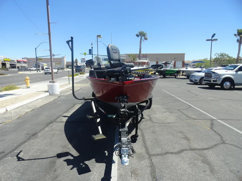 Slide: The Image of 2024 Tracker Pro Guide V-16 SC boat on trailer in parking lot. - 3
