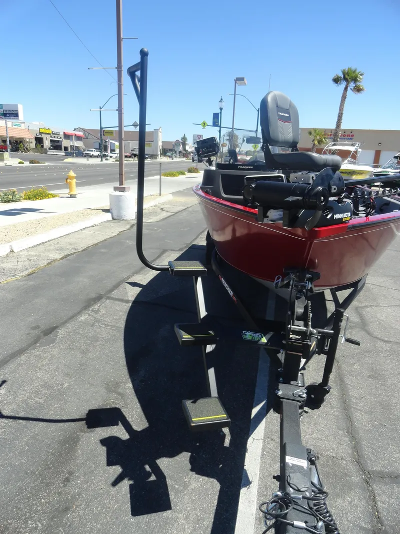 Slide: The Image of 2024 Tracker Pro Guide V-16 SC boat on trailer in parking lot. - 4